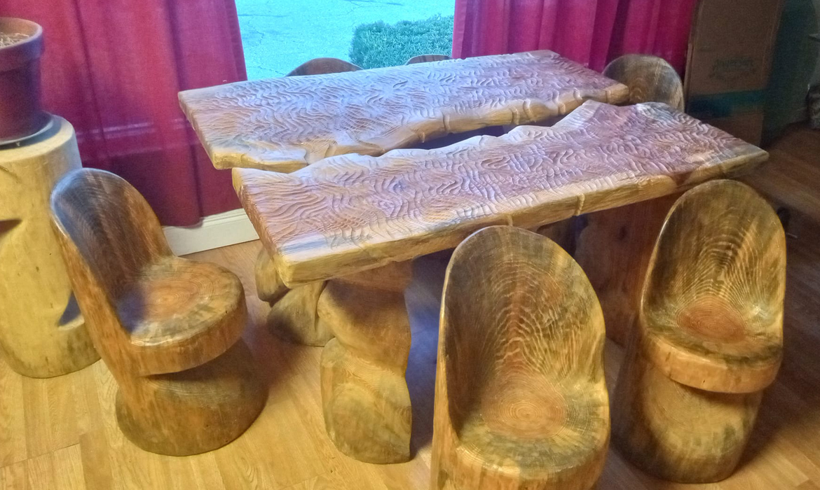 Entire Dining Set Table and 6 Chairs all carved
                  from the same pine tree